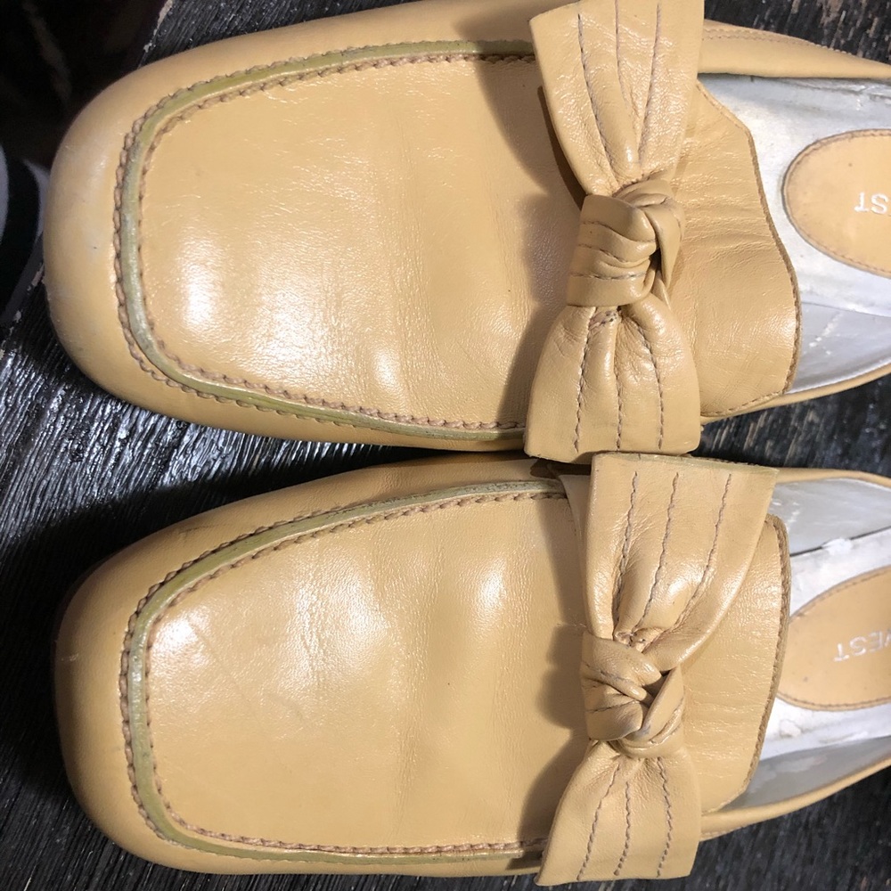 NINE WEST - flat leather mules with bow. Size 6.